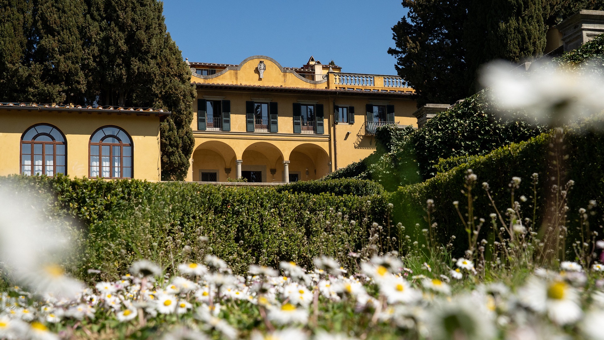 Yellow building and green garden, Italy